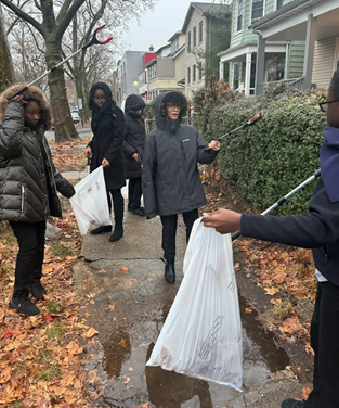 A group of people holding bags and walking on a sidewalk AI-generated content may be incorrect.