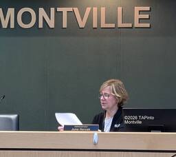 Carousel image 8a9f23293fcca1d13d64 1 june hercek reads fro a written statement regarding the proposed budget