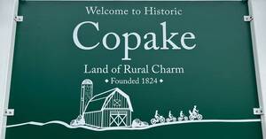 Carousel image c4136fda7da721eeb580 33 34 24comm copake sign