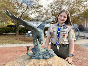 Carousel image 2a4328c811f47001f193 a proud  eagle scout candidate  sara abraham winkler takes a final photo celebrating her completed eagle scout leadership service project. 