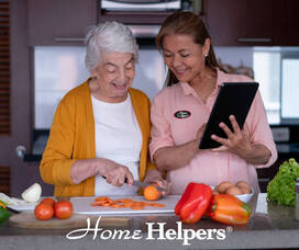 Carousel image ac5ebd69932b4a96a5df beautiful senior mother and daughter at home preparing a vegetarian meal following an online