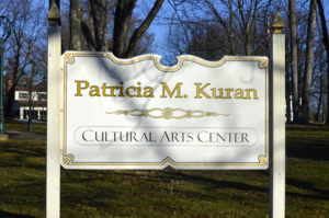 Carousel image 2645c06025a7ea54e8e6 carriage house   patricia kuran cultural art center sign