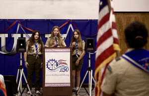 Carousel image 0d2c6abe0933b07d4092  co emcees genevieve and penelope brazell  center   right  kick off the voices of freedom event  as sara abraham winkler awaits the troop 19 honor guard for the pledge of allegiance.