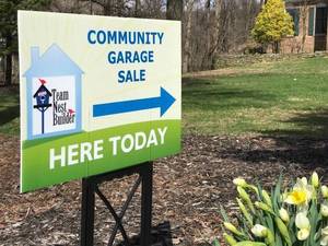 Carousel_image_377a7b1335cd65134404_community_garage_sale_lawn_sign_in_front_lawn__2_