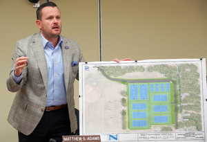 Carousel image a0a22e6653cca61e4ce3 councilman matt adams holds up a kramer manor park rendering at the scotch plains council meeting on tuesday  aug. 20  2024.