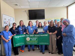 Carousel image 0c8cf6e8fa52131493a8 daisy award winner marisa petrou with colleagues