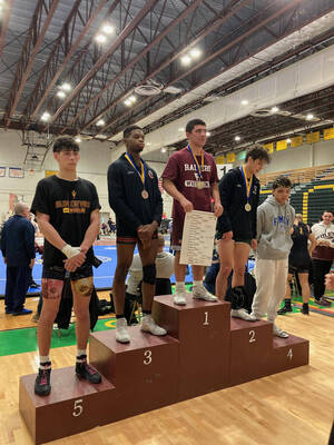 Carousel image 31e41af4304241525ce8 delle volpe standing atop the podium after winning the 157 pound title at the essex county tournament jan 23 2025 by mike policastro