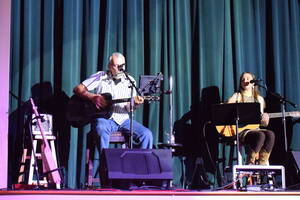 Carousel image 1339c8 hoto of og ettengill performing a song for his wife