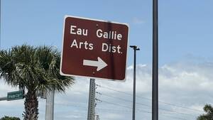 Carousel image 14ed8620611046f3f6cc eau gallie arts district with arrow sign