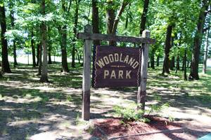 Carousel_image_fc502db81d57a98f8c21_edit_woodland_park_sign