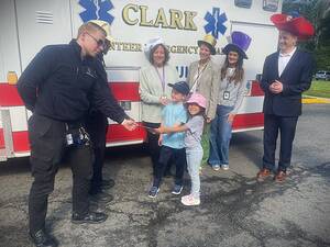 Carousel image e8b745a11d3ebd8bf2fe emt serwick and gray recieve donation from lucie larmony and chase delikat