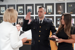 Carousel image 4f0338668a6d8b660d89 fanwood mayor colleen mahr administers the oath of office ti sgt. tyler flowers at the fanwood council meeting of monday  aug. 11  2025.