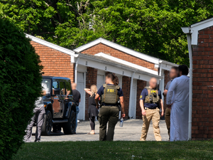 Carousel image af3aae9138183a24939b fbi agents at suburban garage scene