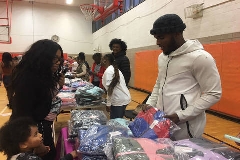Giants Players Distribute Coats to Kids at Newark YMCA - TAPinto.net