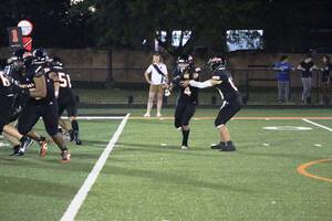 Carousel image 2c91adc1c655e569c321 hasbrouck heights qb daniel amendola hands off to mike napolitano