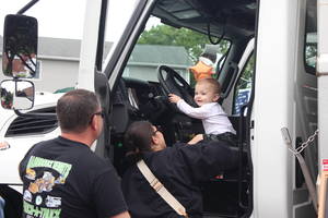 Carousel image 368acf1805bbc1438328 hasbrouck heights dpw touch a truck baby in truck