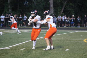 Carousel image 952577481485624dabb2 hasbrouck heights qb daniel amendola hands off to michael napolitano