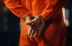 Carousel image c1bd01 an in andcuffs