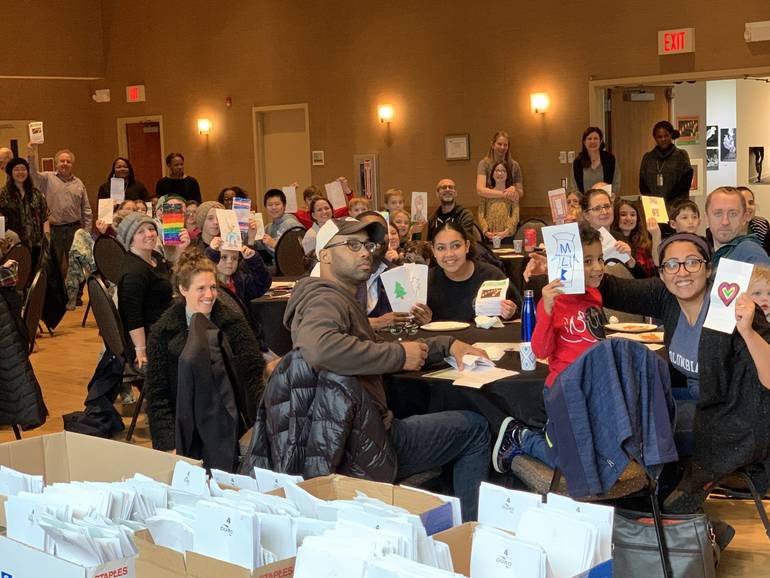 Children And Parents Decorate Luminaries In Preparation Of Martin