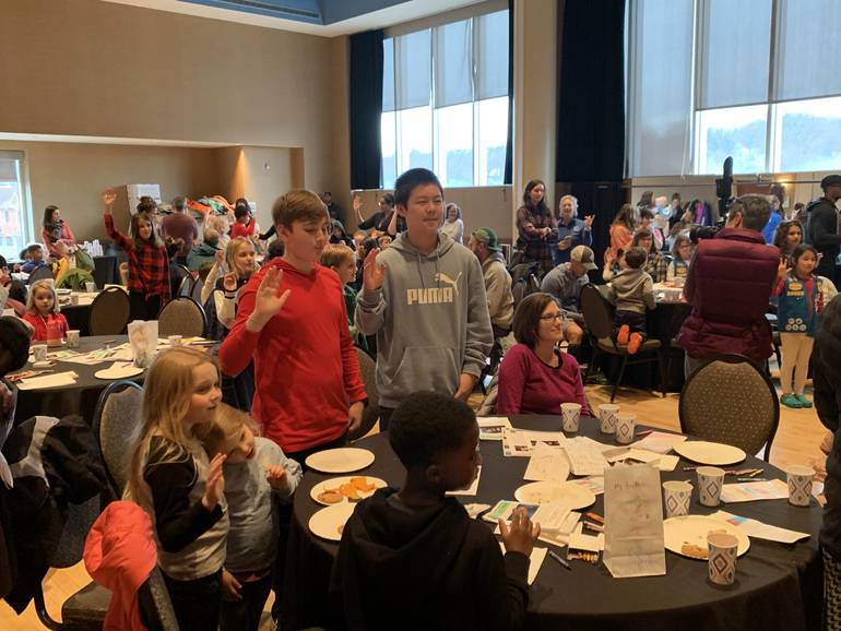 Children And Parents Decorate Luminaries In Preparation Of Martin