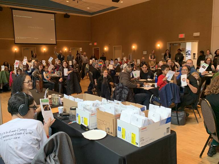 Children And Parents Decorate Luminaries In Preparation Of Martin