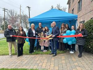 Carousel image 76efc3 earny ellness ribbon cutting
