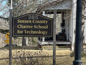 Carousel image fcaf91 urrent ussex ounty harter chool sign