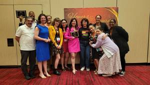 Carousel image 17408358790da2dbdc14 jennie pu  center  recieved the award for librarian of the year