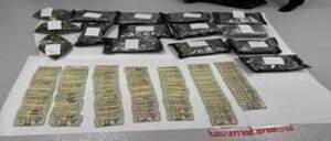 Carousel image bbfcfc eized marijuana and cash shown following arrest elbourne