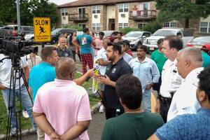 Carousel image d762f9f714eaf4567b23 mayor joshi outside of evergreen meadows with displaced residents
