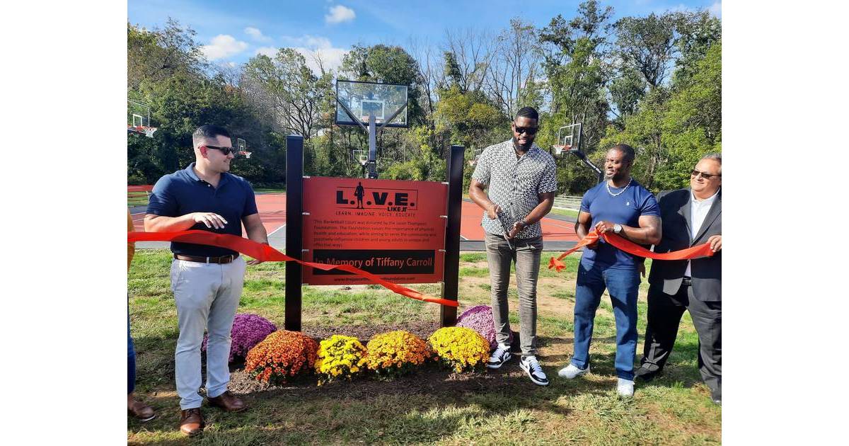 Jason Thompson Cuts Ribbon on New Donated Basketball Court at Laurel