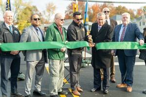 Carousel image ed961cd9168737eed343 oak tree road streetlight ribbon cutting