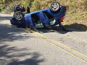 Carousel image e6997a58a96e4a2ac2e8 overturned car