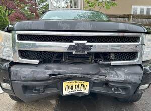 Carousel image 71353e932f8ac02f6a93 pick up with wrecked front bumper