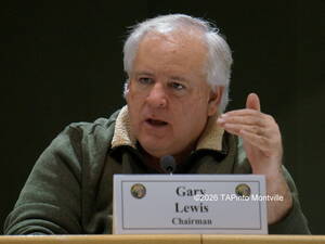 Carousel image 633cde23cc52581835c7 planning board chair gary lewis at a 2018 planning board meeting
