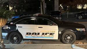 Carousel image fabb684566035a9611f2 police car at night