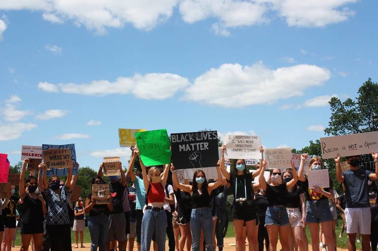 Gl Students Take To The Streets In Community Protest To Make Their