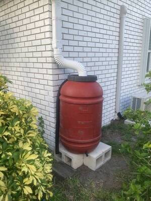 Carousel image 58cf8612838e96ac8830 rain barrel on the side of a home original