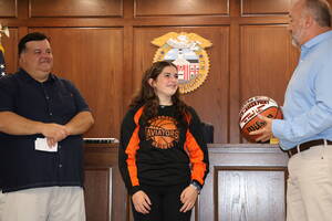 Carousel image d86405e18aa133ae7ba4 rob brady presents savannah davis with 1000 point basketball along with her father mike davis