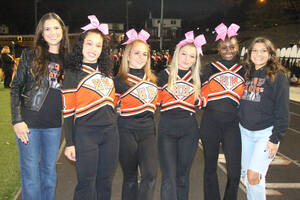 Carousel image 8e162778904551ed93b6 senior cheerleaders with coaches