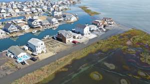 Carousel_image_80551b0c252585df8c77_sompixnjshorefloodingtuckertonhouses
