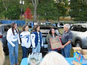 Carousel image bd7084542ccbf971e840 tailgate phelps presents plaque hhs fb img 1760551929747