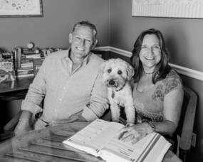 Carousel image 1c7c62c93e0cdcb21477 team two rivertom and ann murdock  owners of two river college group and two river tutoring  with their pup  april