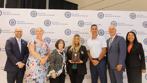 Carousel image b9f02db064bdc583b4bc teacher of the year