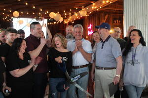 Carousel image f480de4aa258645cf5b7 tin barn ribbon cutting