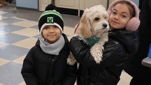 Carousel image 110ab7cffebf474a14b3 two kids with their dog