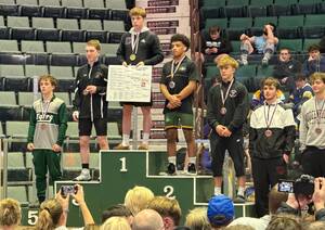 Carousel image 8679ec0d9af1d48a1504 web   wrestling state qualifiers 1