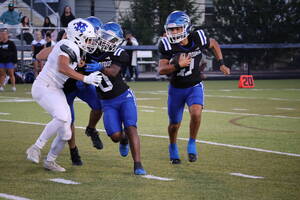 Carousel image 0f39ab22eb3d8dc7da01 wood ridge quarterback chris rios runs the ball while myles simmonds blocks against st mary at home fri sept 12