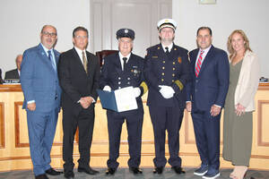 Carousel image 73030b6b3acbed6e9fe2 wood ridge firefighter steve sarracino with mayor and council