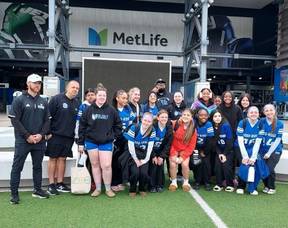 Carousel image ca3b5583d0208b50ccd8 wr flag team in front of ml